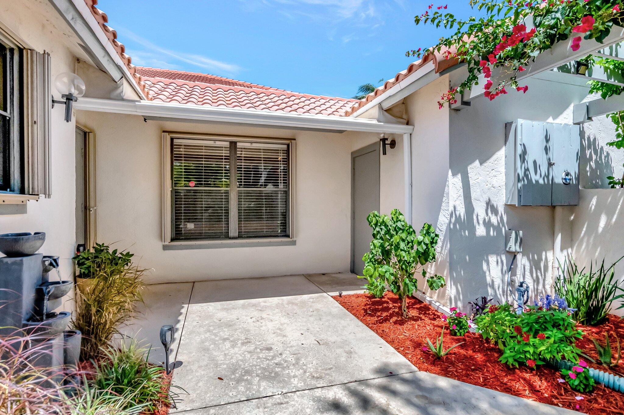 21687 Cromwell Circle Boca Raton, FL 33486 - Photo 27 of 52 Covered Space b/w Garage & Home