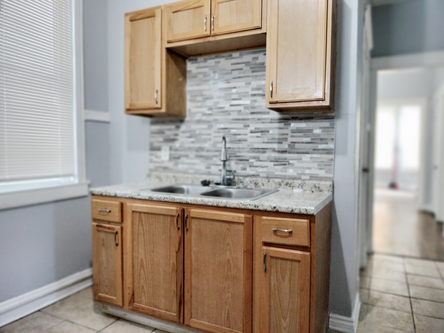 6719 South Sangamon Street, Unit 1 Chicago, IL 60621 - Photo 17 of 23 a kitchen with stainless steel appliances granite countertop a sink and a granite counter tops