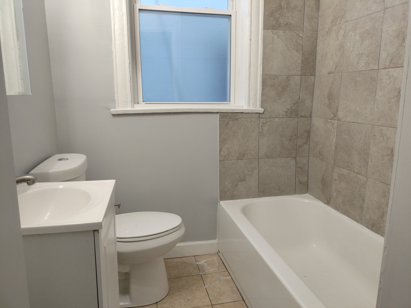 6719 South Sangamon Street, Unit 1 Chicago, IL 60621 - Photo 23 of 23 a bathroom with a toilet and a bathtub