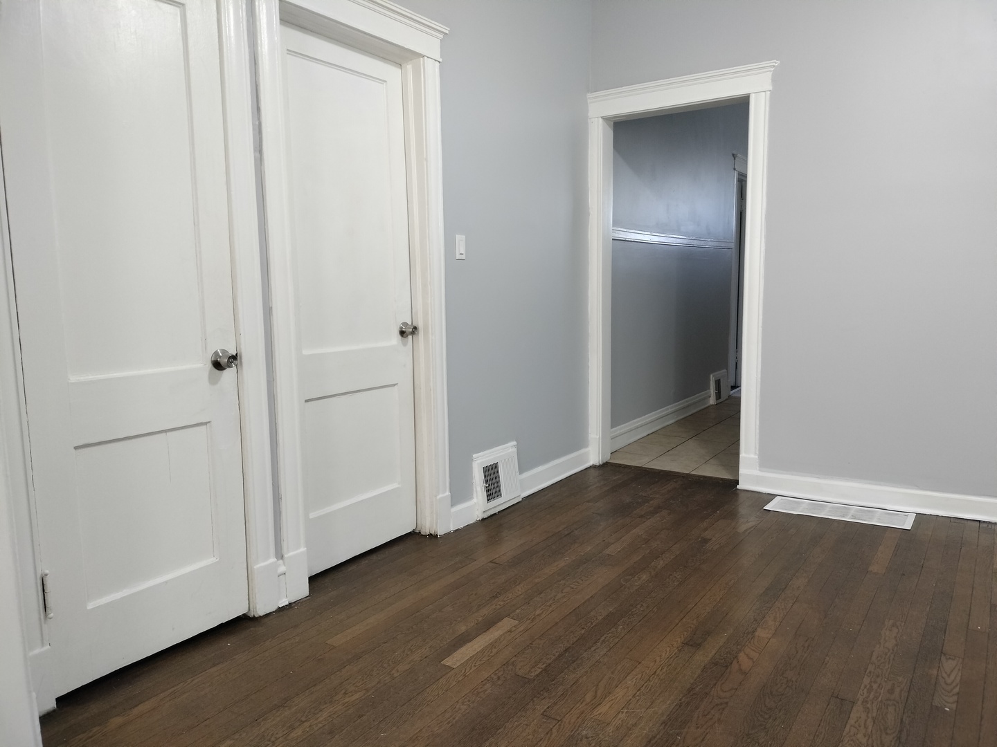 6719 South Sangamon Street, Unit 1 Chicago, IL 60621 - Photo 4 of 23 an empty room with wooden floor & closet area