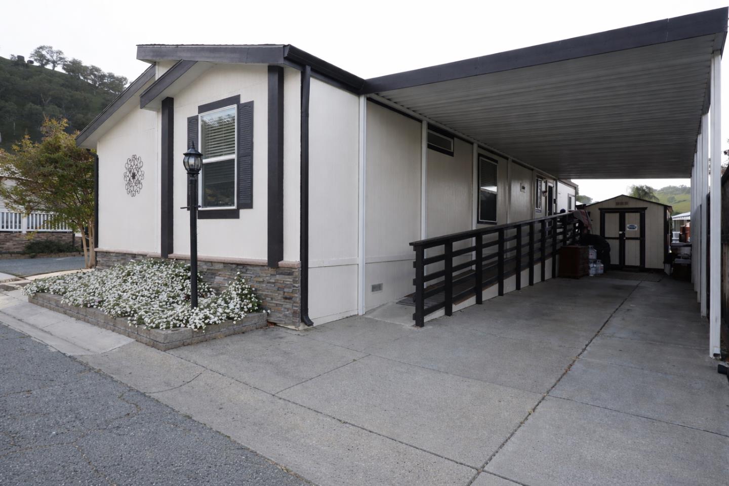 16711 Marsh Creek Road, Unit 74 Clayton, CA 94517 - Photo 4 of 11 a backyard of a house with barbeque oven table and chairs