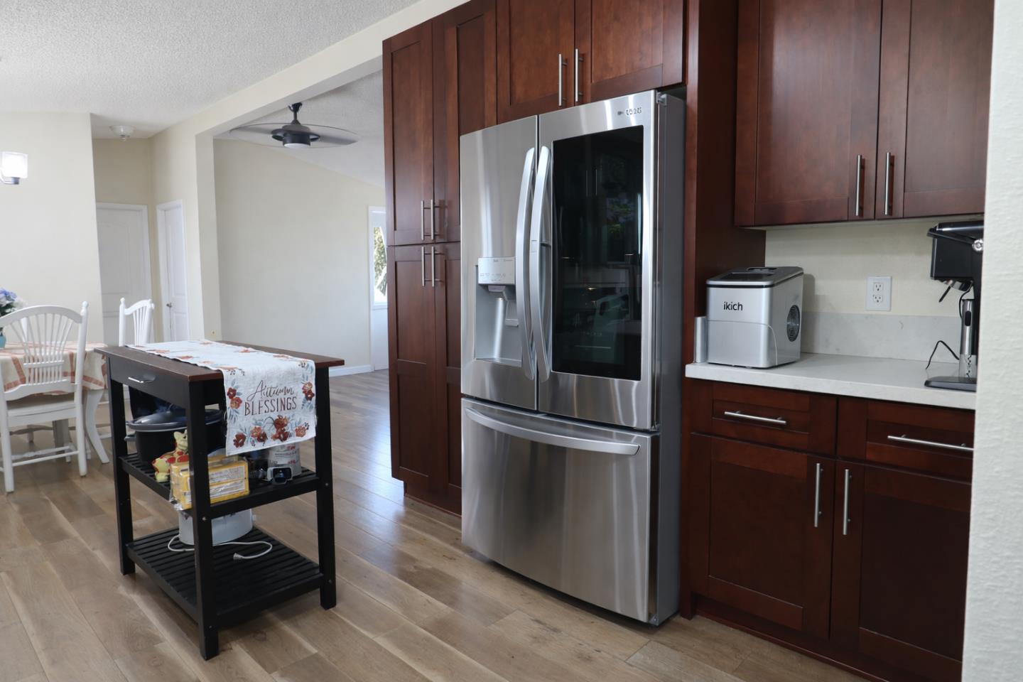 16711 Marsh Creek Road, Unit 74 Clayton, CA 94517 - Photo 5 of 11 a kitchen with stainless steel appliances a refrigerator and wooden cabinets