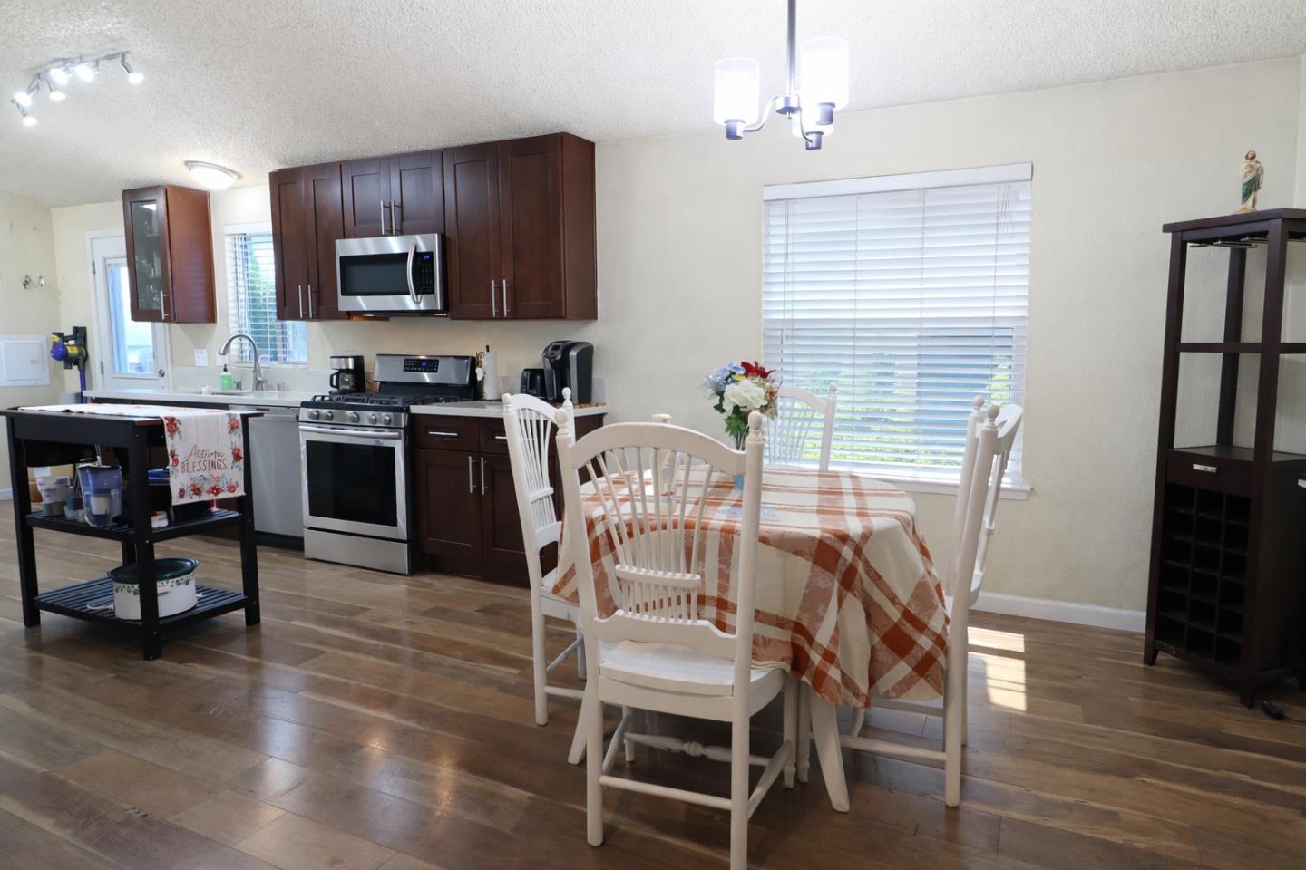 16711 Marsh Creek Road, Unit 74 Clayton, CA 94517 - Photo 7 of 11 a view of a dining room with furniture and wooden floor