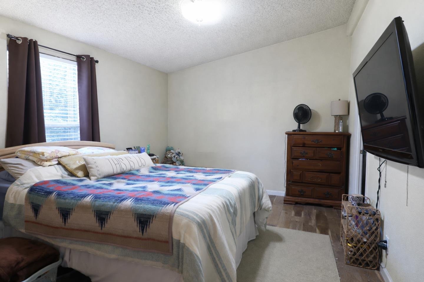 16711 Marsh Creek Road, Unit 74 Clayton, CA 94517 - Photo 9 of 11 a bedroom with a bed and furniture