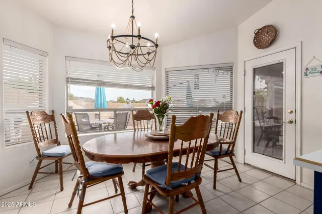 a view of a dining room with furniture window and outside view