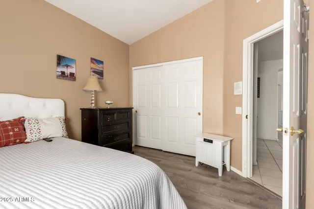 a bedroom with a bed and a closet