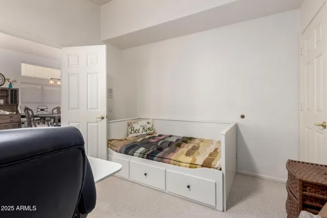 a bedroom with bed and furniture