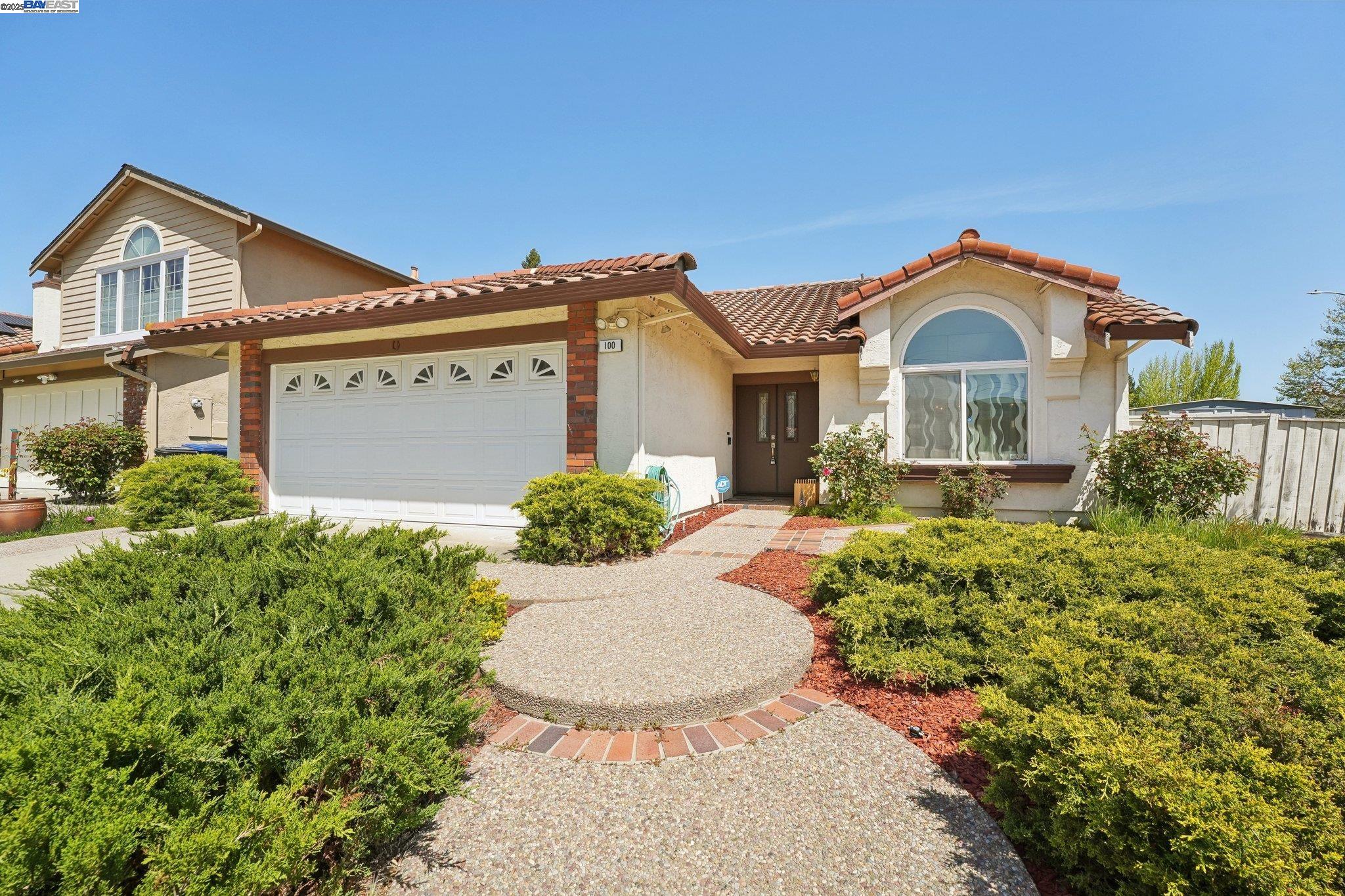100 Fallbury Court San Ramon, CA 94583 - Photo 1 of 1 a front view of a house with a yard and potted plants