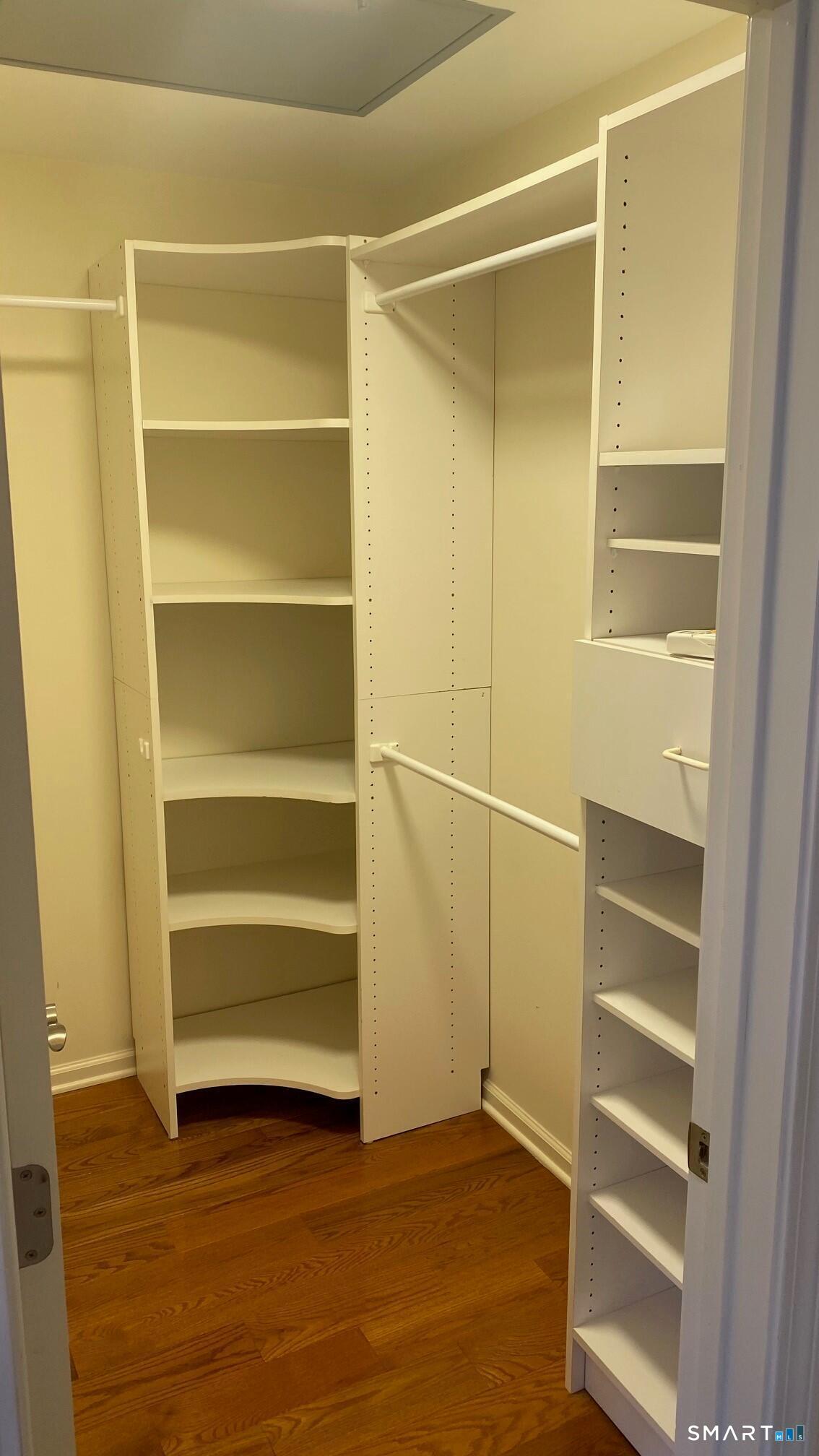 403 Larson Drive, Unit 403 Danbury, CT 06810 - Photo 15 of 34 a view of walk in closet with empty racks