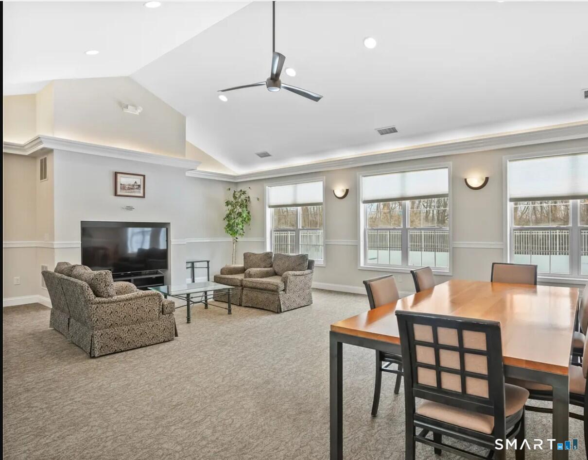 403 Larson Drive, Unit 403 Danbury, CT 06810 - Photo 31 of 34 a living room with furniture and a flat screen tv