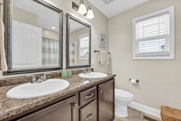 a bathroom with a shower and a glass door