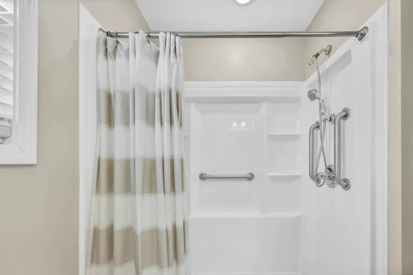 a bathroom with a granite countertop sink toilet and a mirror