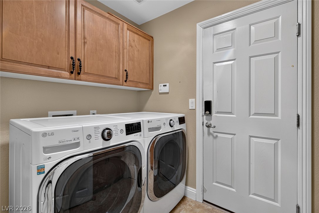 818 Manor Shores Road Henderson, NV 89002 - Photo 26 of 35 Ample storage and modern laundry units define this functional utility space.