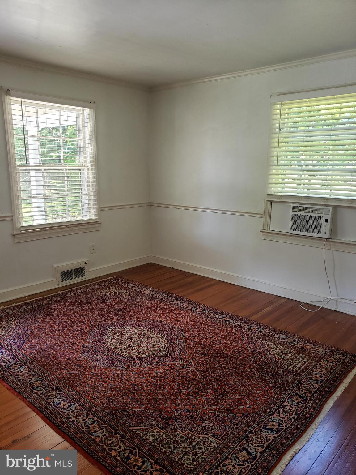 38799-38795 Hughesville Road Leesburg, VA 20175 - Photo 6 of 9 a view of a room with a wooden floor and a window