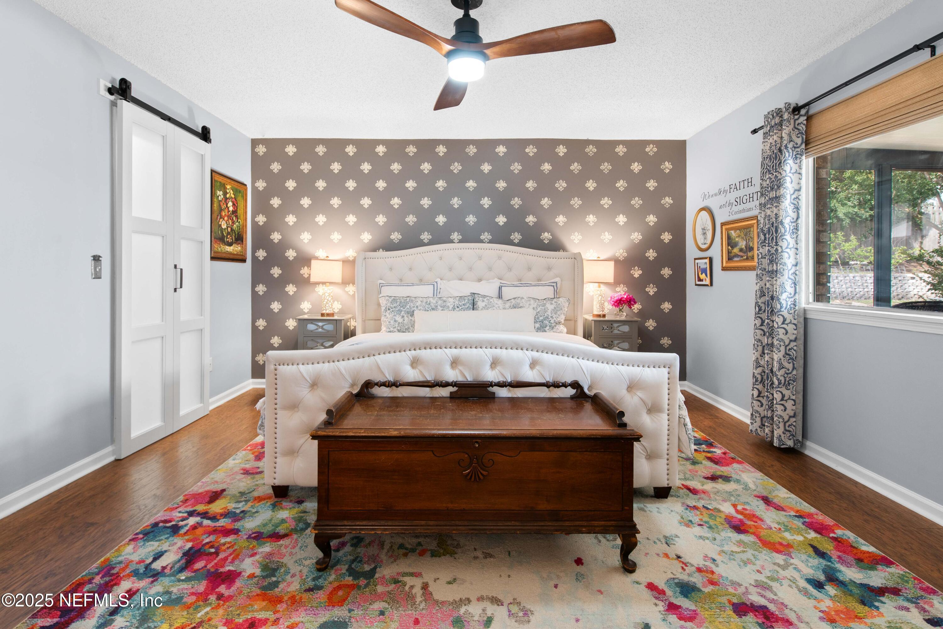 2894 Circle Ridge Drive Orange Park, FL 32065 - Photo 15 of 30 a bedroom with a bed and wooden floor