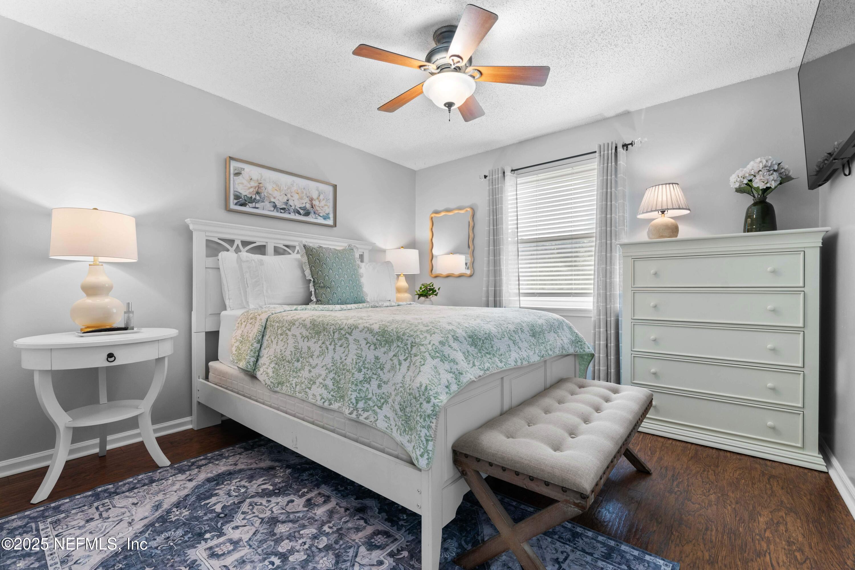 2894 Circle Ridge Drive Orange Park, FL 32065 - Photo 18 of 30 a bedroom with a bed and a chandelier