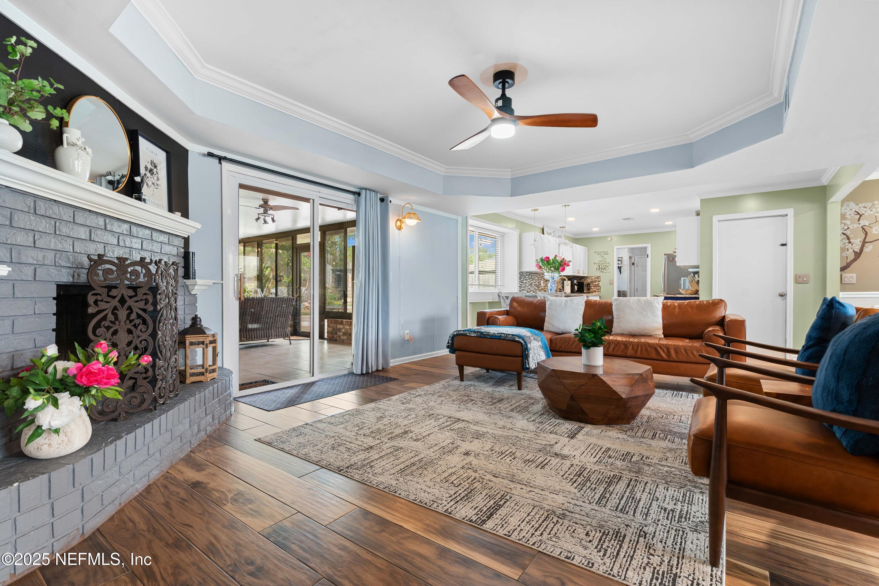 2894 Circle Ridge Drive Orange Park, FL 32065 - Photo 5 of 30 a living room with furniture potted plant and a fireplace