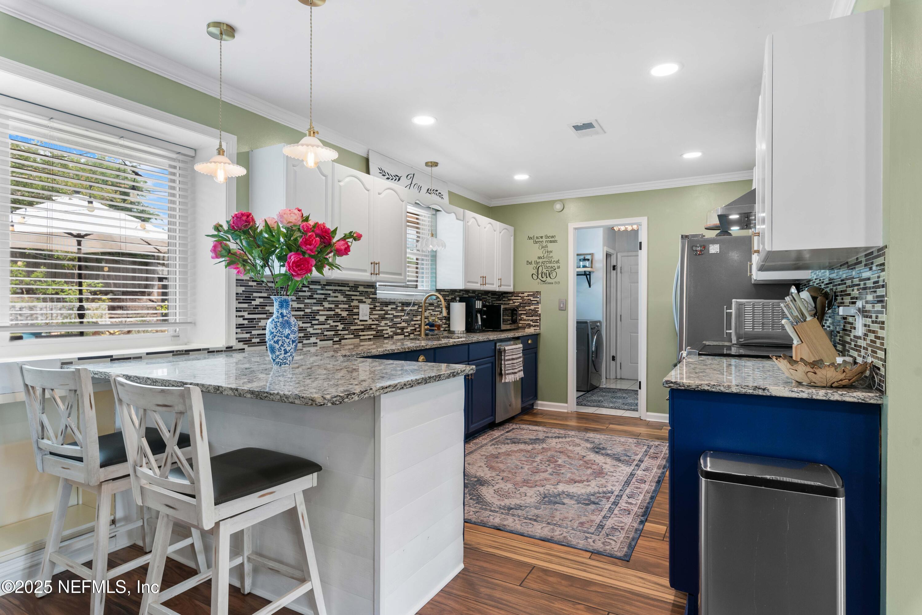 2894 Circle Ridge Drive Orange Park, FL 32065 - Photo 9 of 30 a kitchen with granite countertop a sink and cabinets