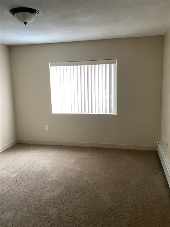 175 Ward Street, Unit 30 Revere, MA 02151 - Photo 11 of 20 an empty room with a window