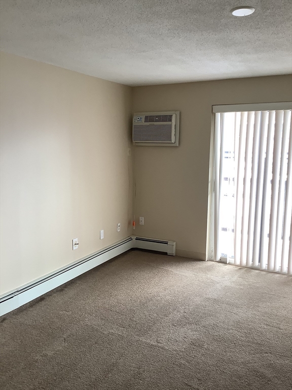 175 Ward Street, Unit 30 Revere, MA 02151 - Photo 2 of 20 an empty room with windows