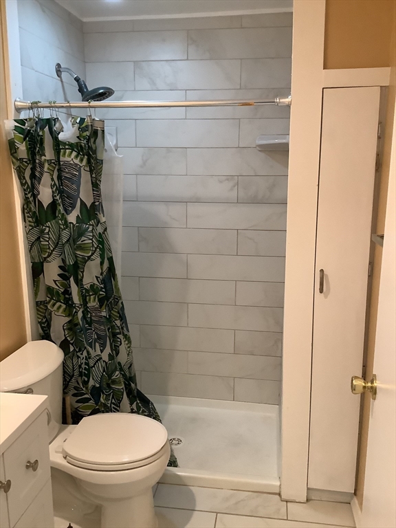 175 Ward Street, Unit 30 Revere, MA 02151 - Photo 4 of 20 a bathroom with a shower and a toilet