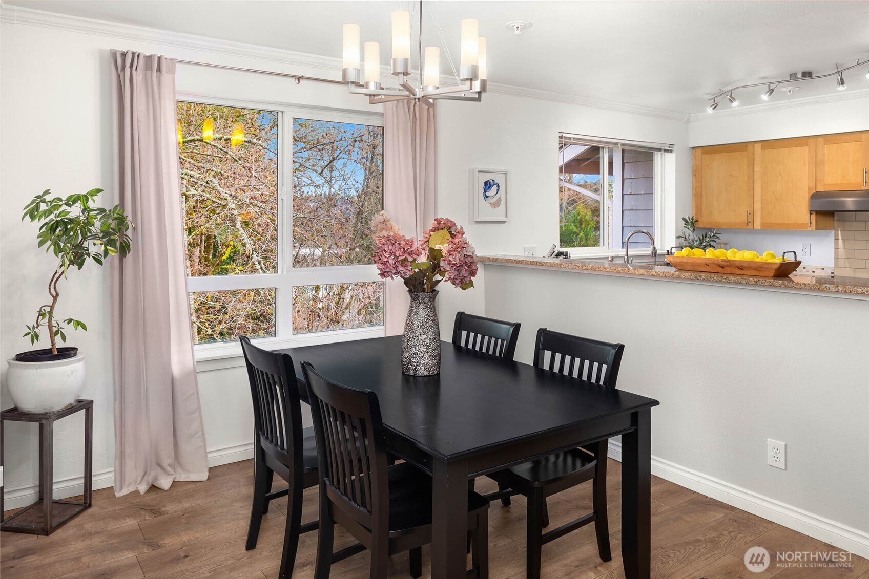 12023 Northeast 204th Place, Unit E302 Bothell, WA 98011 - Photo 11 of 26 a view of a dining room with furniture window and outside view