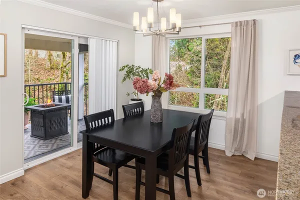 a view of a dining room with furniture window and wooden floor