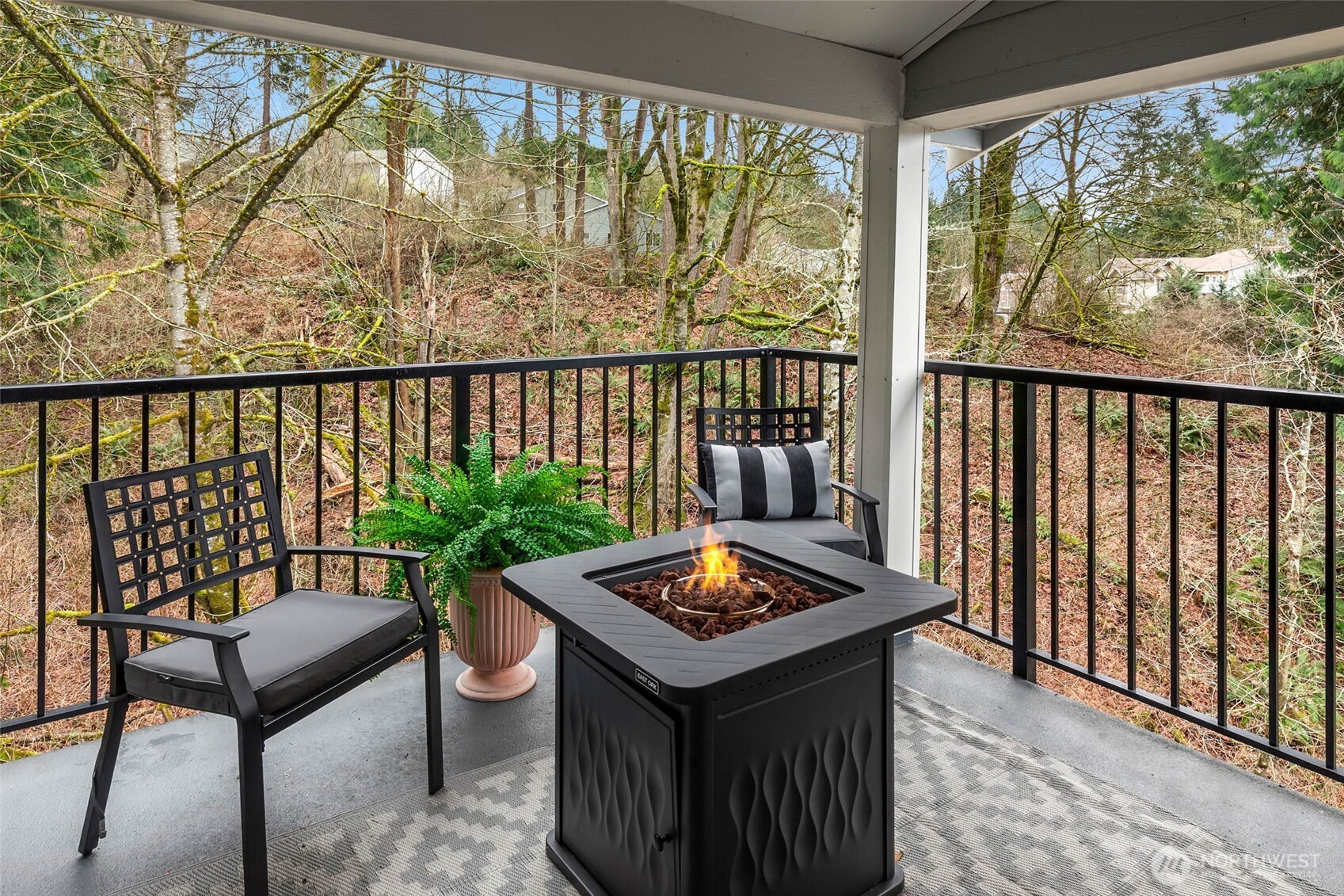 12023 Northeast 204th Place, Unit E302 Bothell, WA 98011 - Photo 14 of 26 a living room with a table and chairs