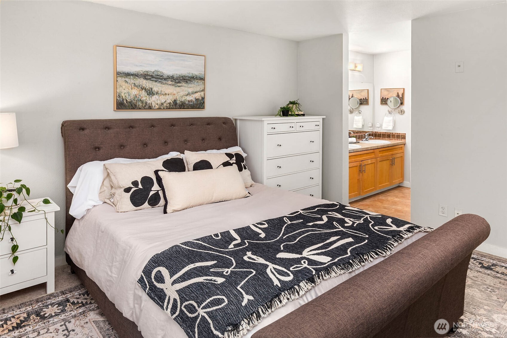 12023 Northeast 204th Place, Unit E302 Bothell, WA 98011 - Photo 17 of 26 a bedroom with a bed and a window