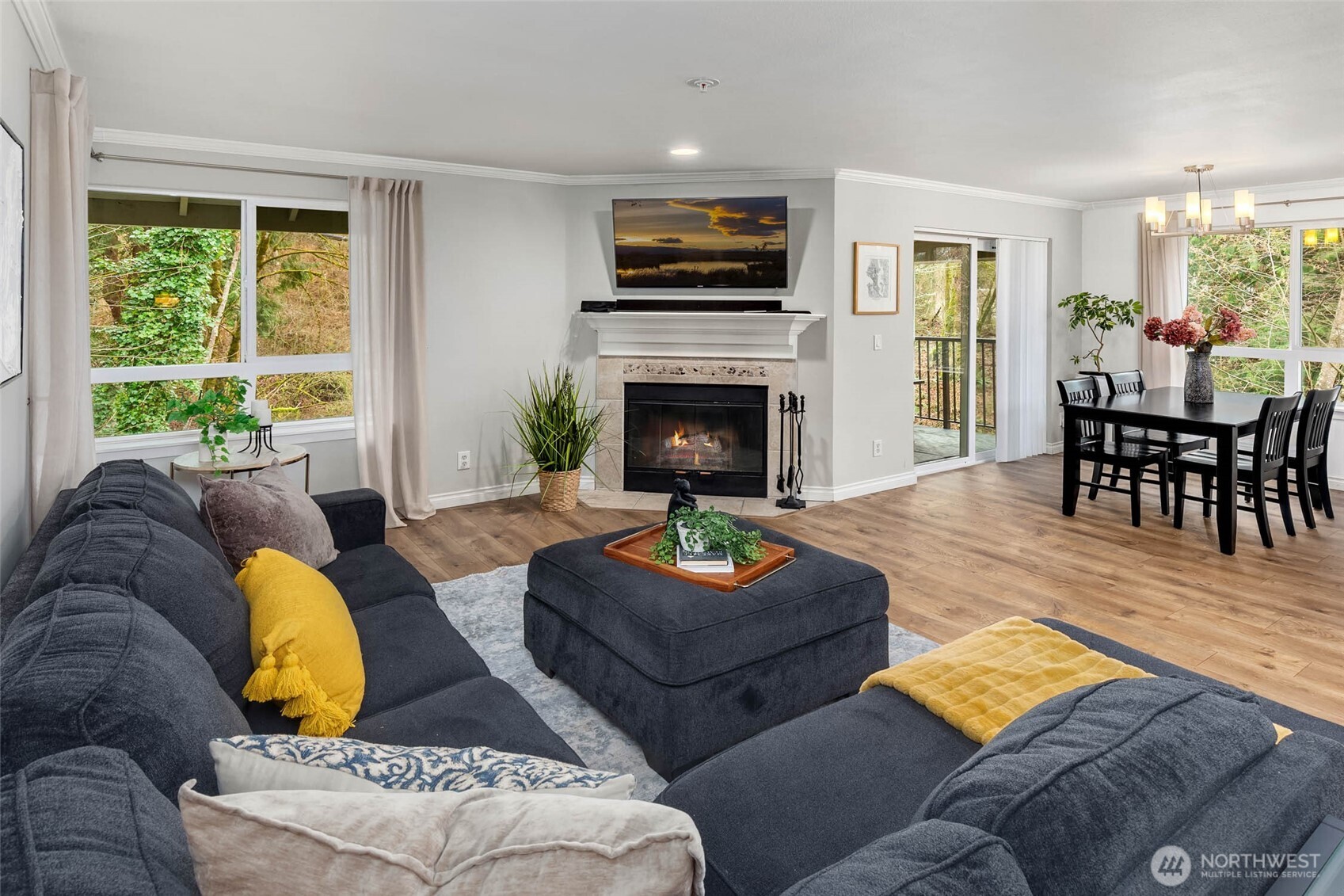 12023 Northeast 204th Place, Unit E302 Bothell, WA 98011 - Photo 4 of 26 a living room with furniture fireplace and window