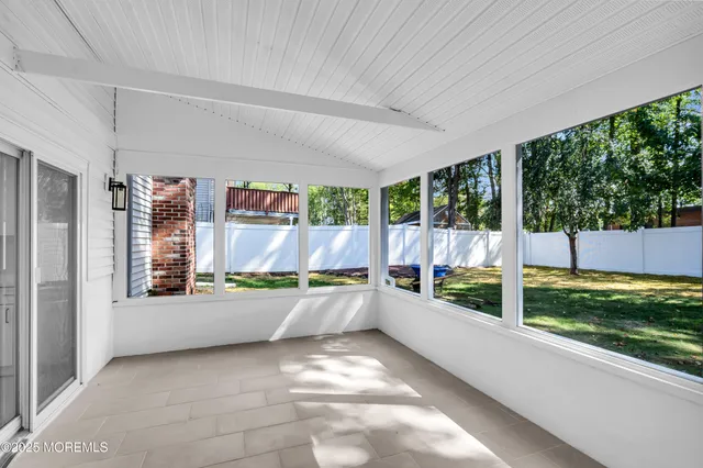 a view of a back yard and patio