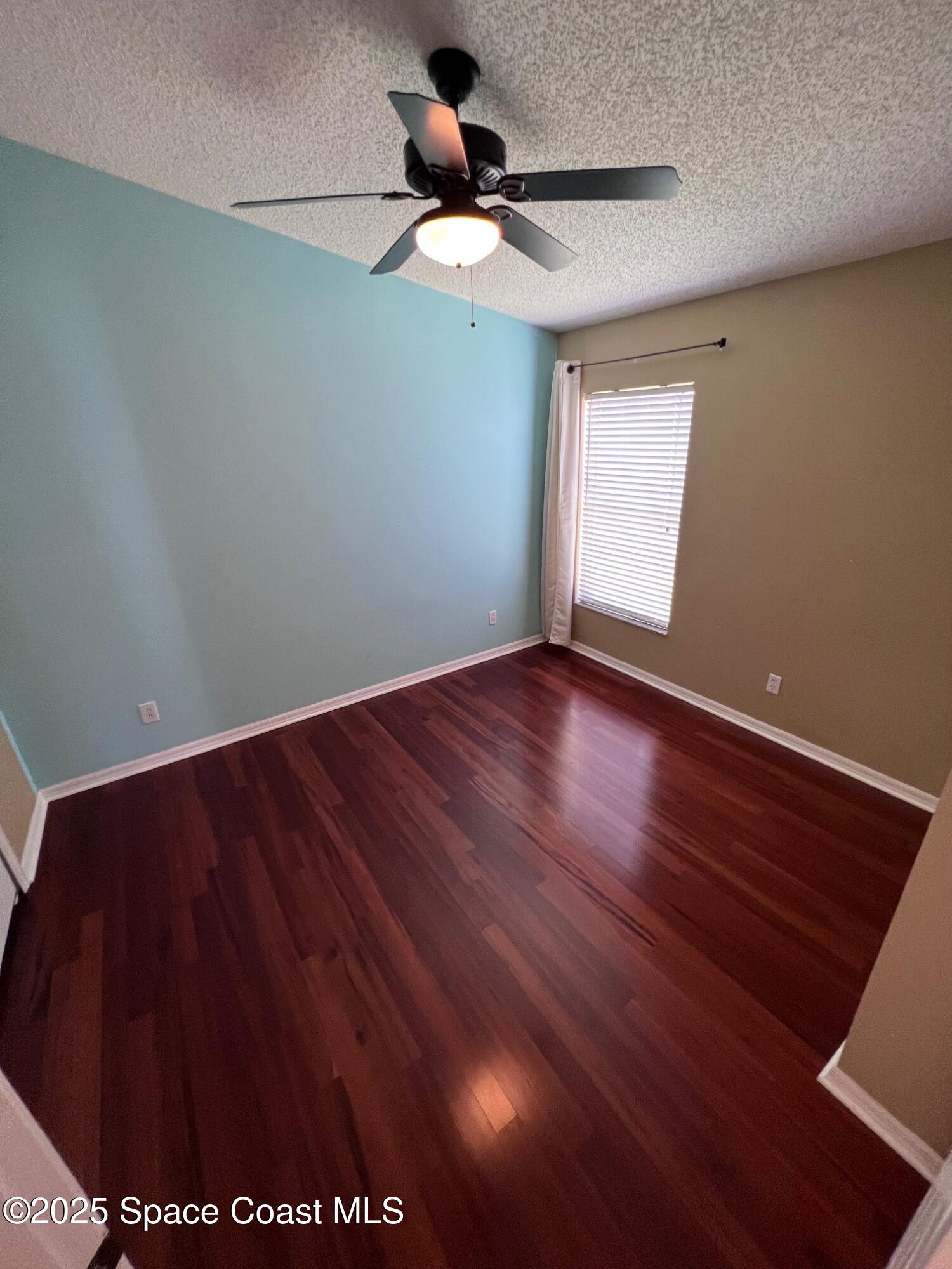 2149 Caledonia Place Melbourne, FL 32940 - Photo 12 of 18 a view of room with window and hardwood floor
