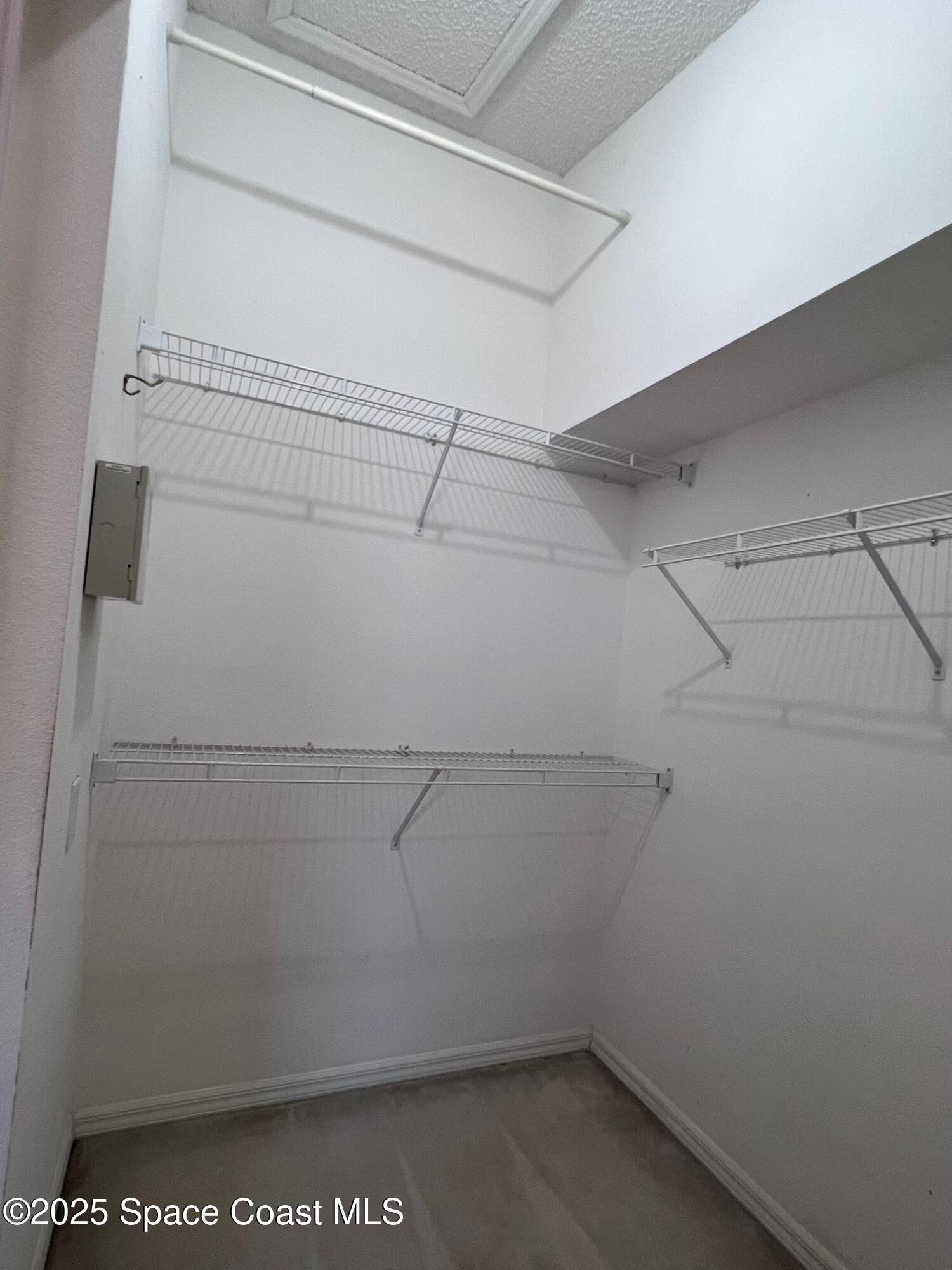 2149 Caledonia Place Melbourne, FL 32940 - Photo 13 of 18 a view of a room with racks on the wall