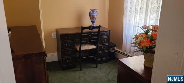 79 Washington Street Harrison, NJ 07029 - Photo 18 of 25 a room with a table and a potted plant
