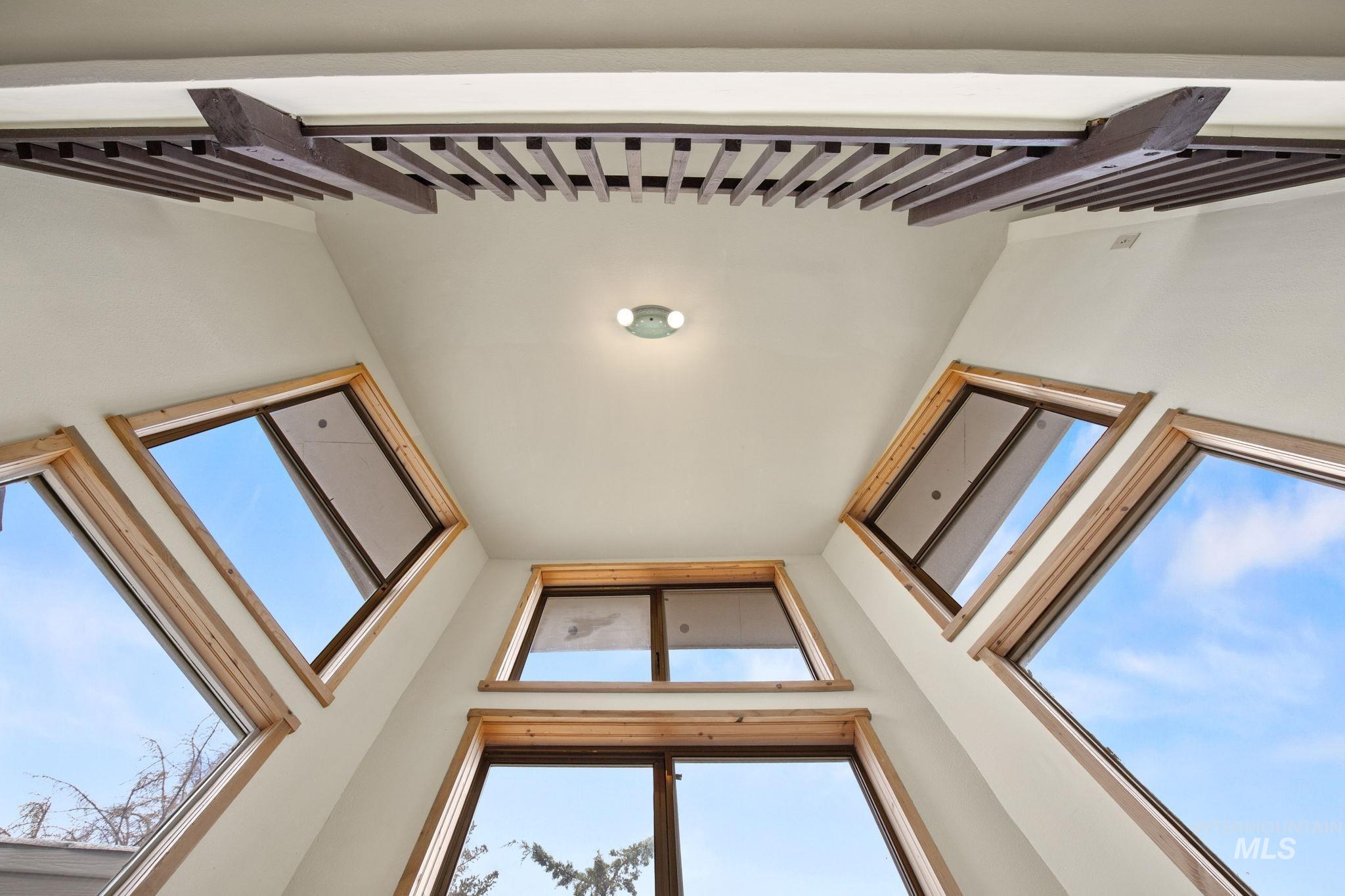 18338 Pride Lane Caldwell, ID 83607 - Photo 20 of 50 Vaulted ceiling featuring a decorative wood slat accent and recessed lighting