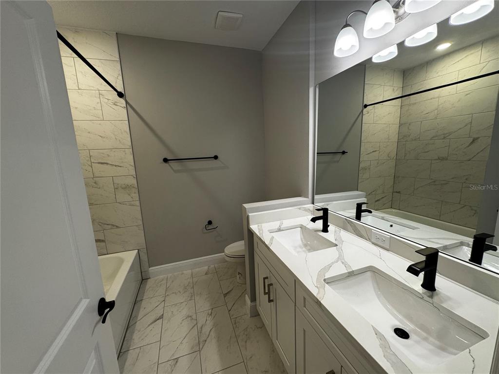 13101 Southwest 72nd Terrace Road Ocala, FL 34473 - Photo 14 of 18 a bathroom with a sink and mirror