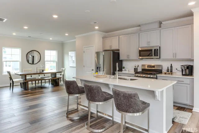 a kitchen that has a lot of cabinets in it