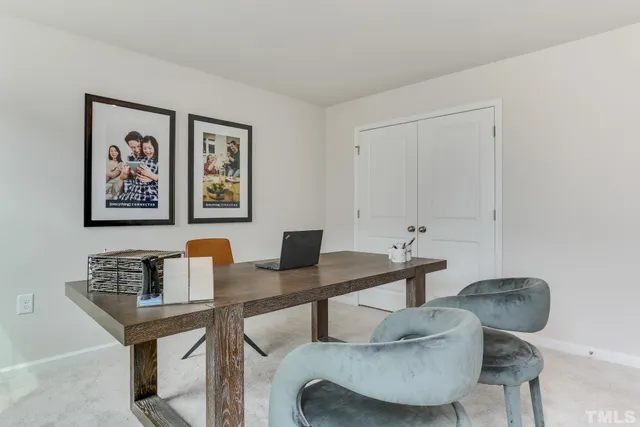 a living room with furniture and windows
