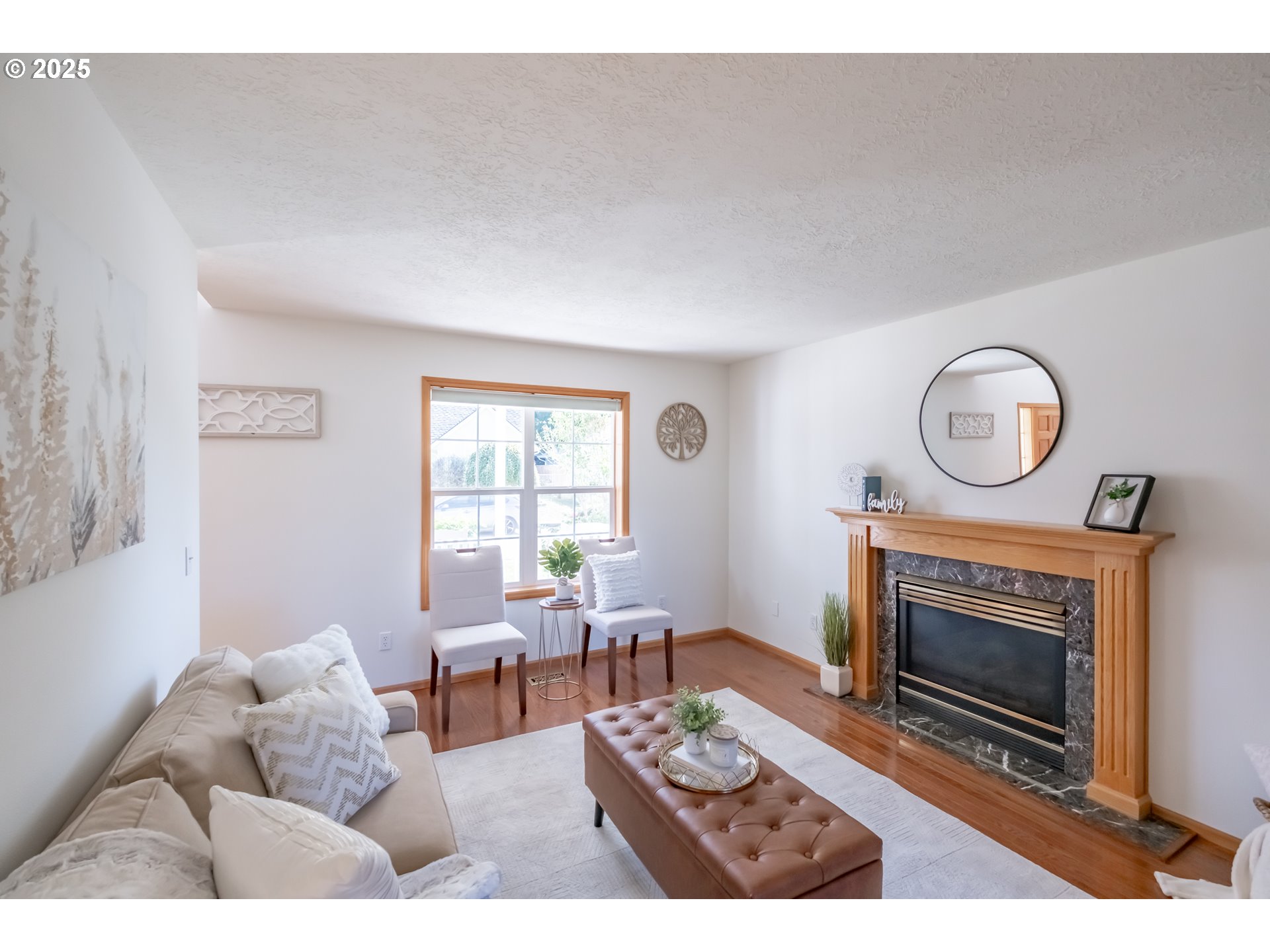 2009 Chase Loop Southwest Albany, OR 97321 - Photo 11 of 48 a living room with furniture a clock and a fireplace