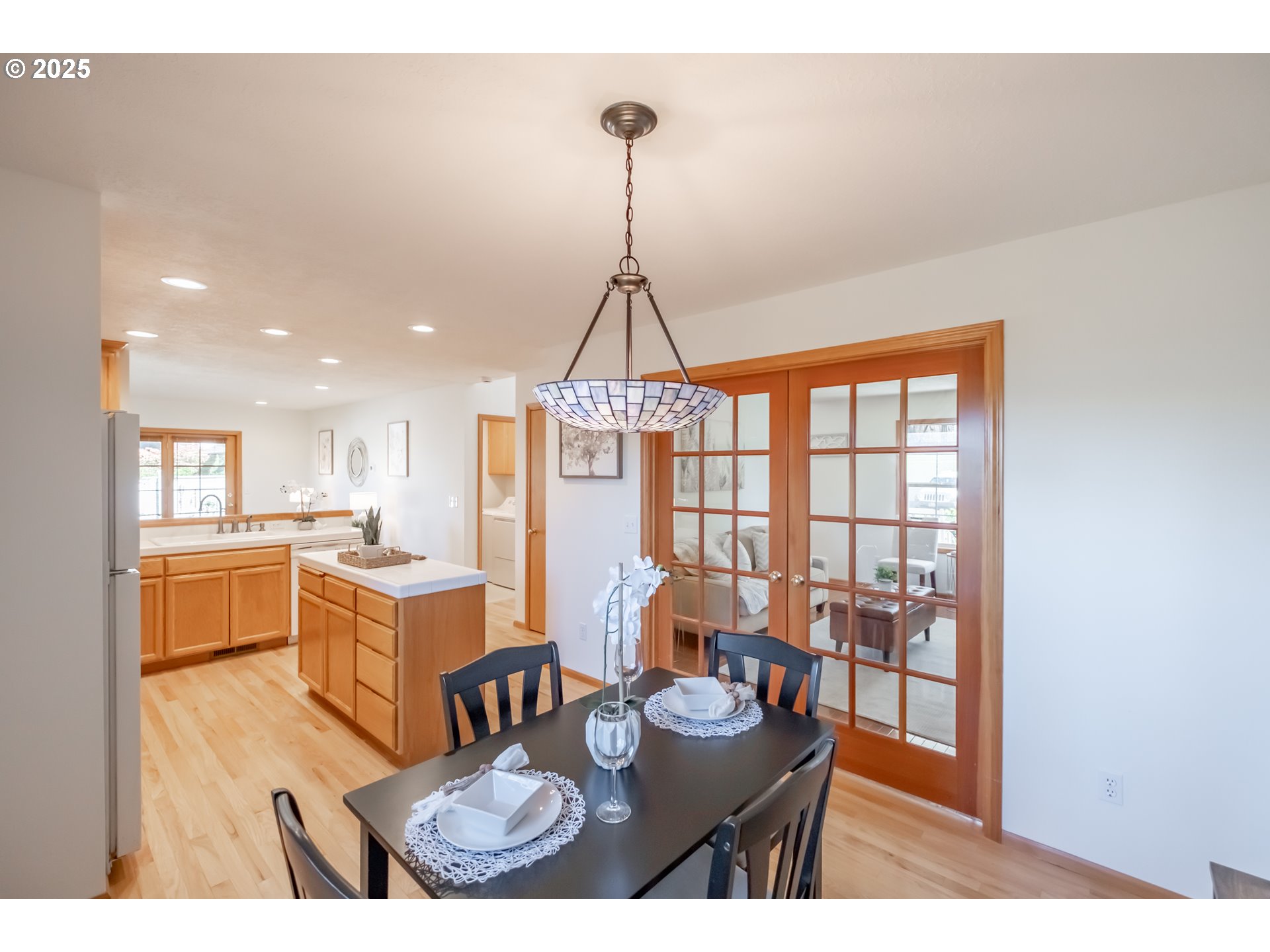 2009 Chase Loop Southwest Albany, OR 97321 - Photo 12 of 48 a dining room with furniture a chandelier and wooden floor
