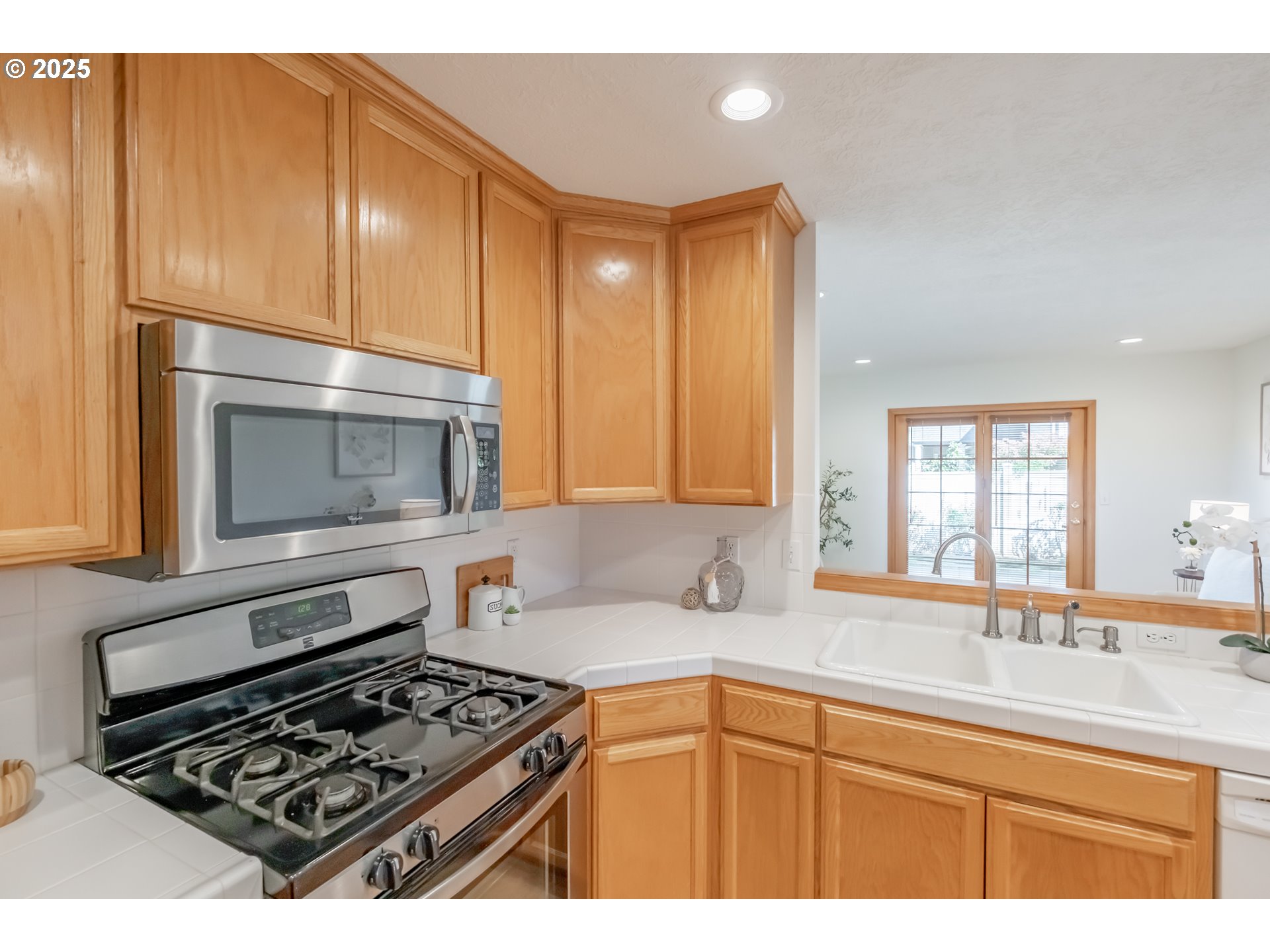 2009 Chase Loop Southwest Albany, OR 97321 - Photo 16 of 48 a kitchen with stainless steel appliances a stove sink and cabinets