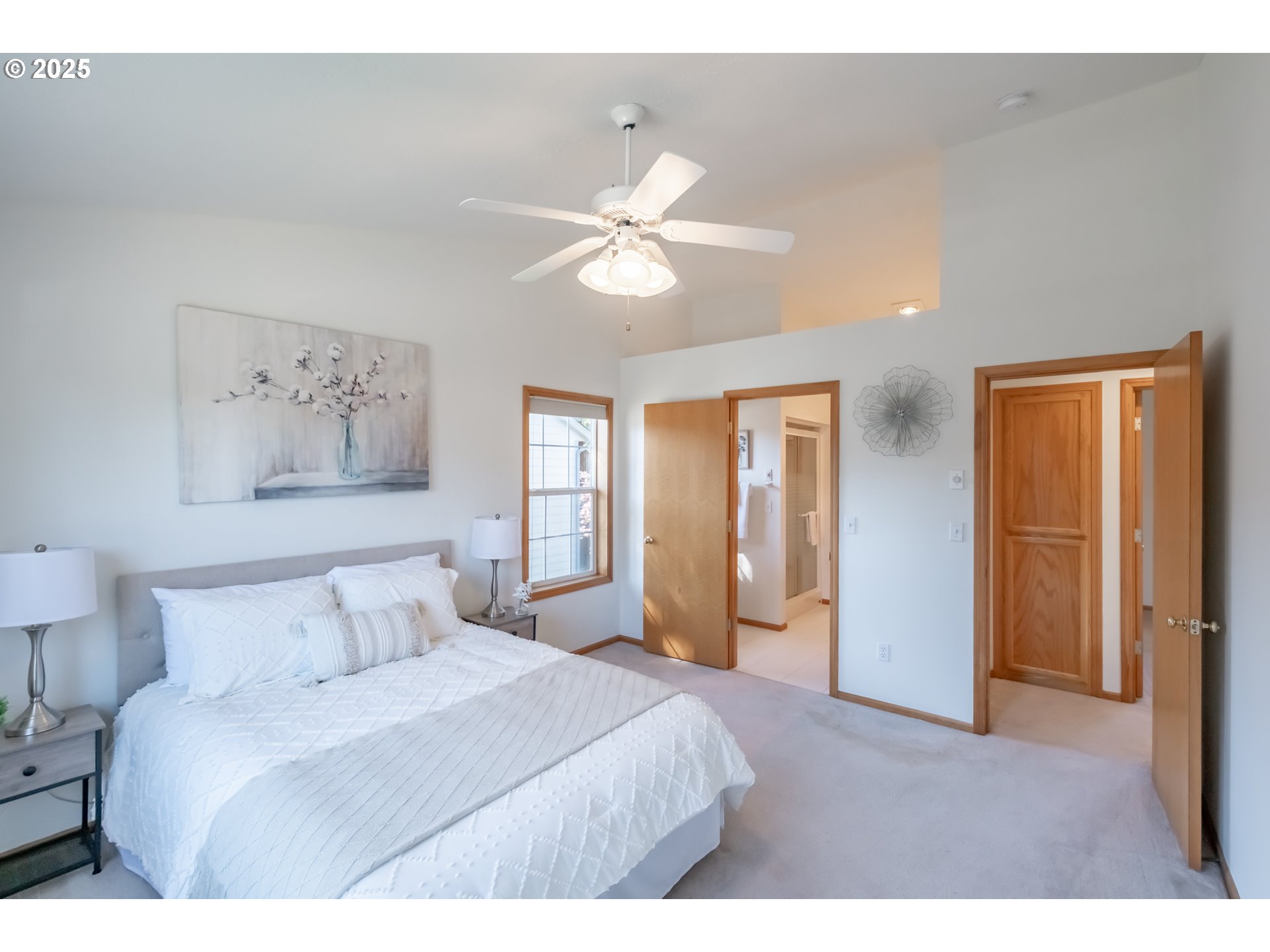 2009 Chase Loop Southwest Albany, OR 97321 - Photo 27 of 48 a bedroom with a large bed and a chandelier