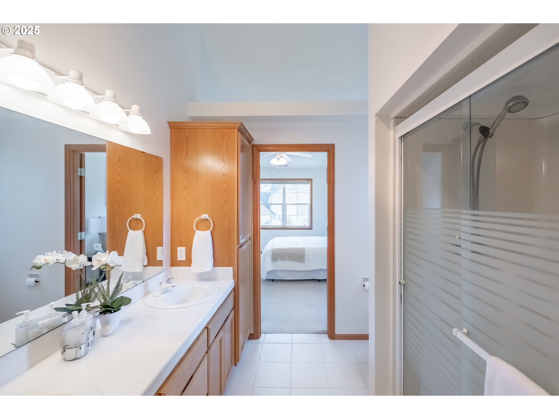 2009 Chase Loop Southwest Albany, OR 97321 - Photo 30 of 48 a bathroom with a sink a mirror and a shower