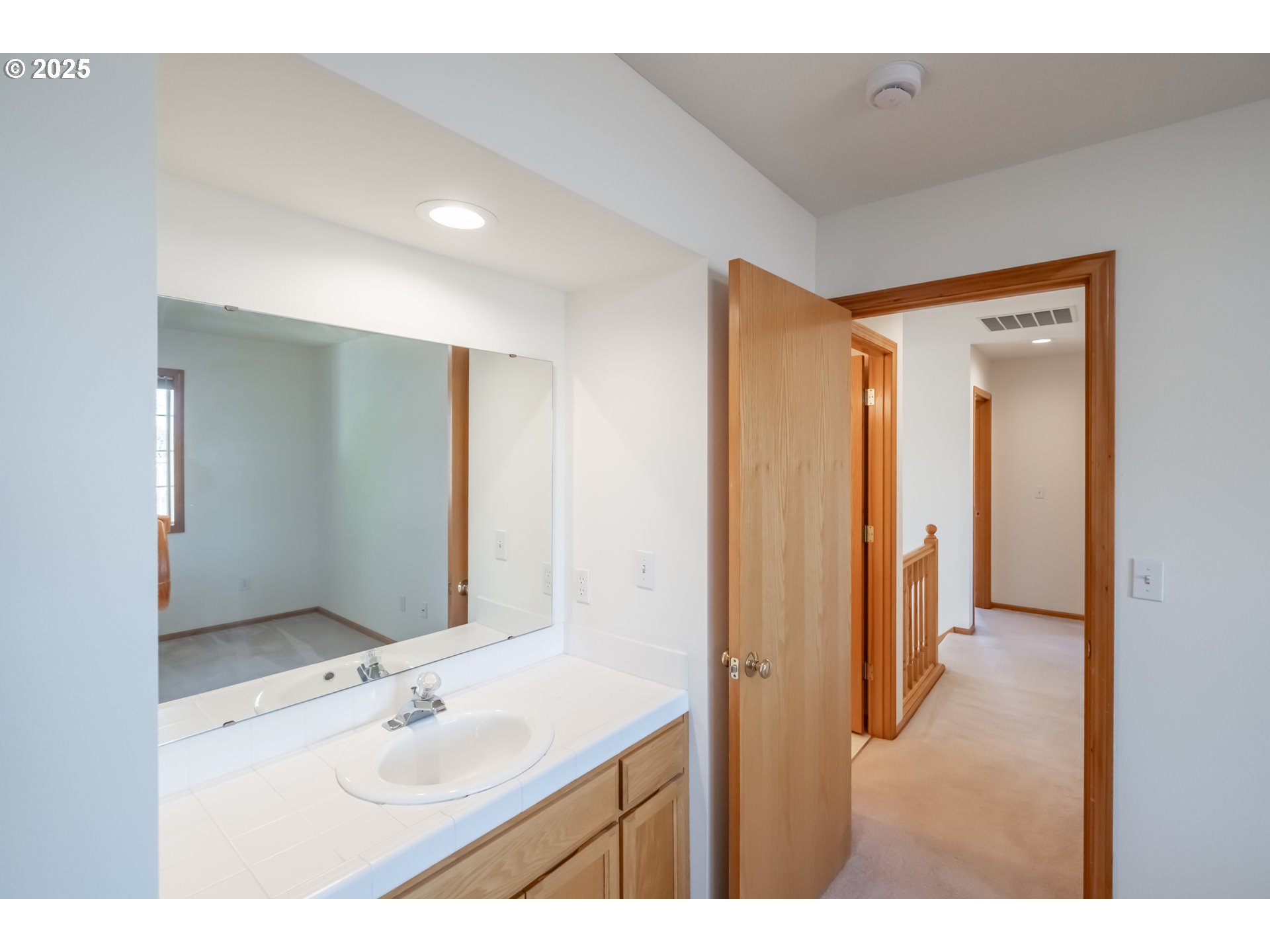 2009 Chase Loop Southwest Albany, OR 97321 - Photo 38 of 48 a bathroom with a double vanity sink mirror and shower
