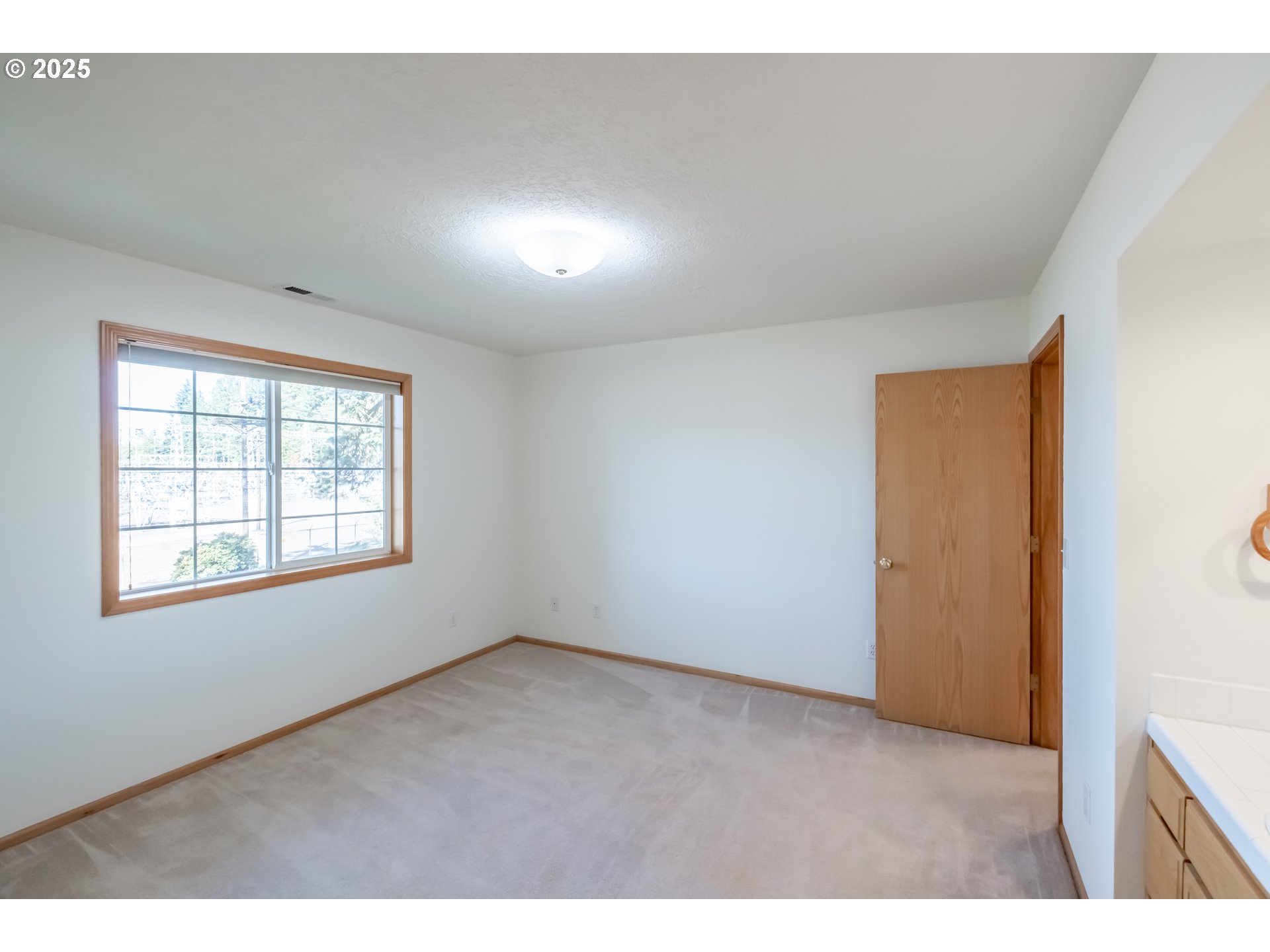 2009 Chase Loop Southwest Albany, OR 97321 - Photo 40 of 48 a view of an empty room with a window