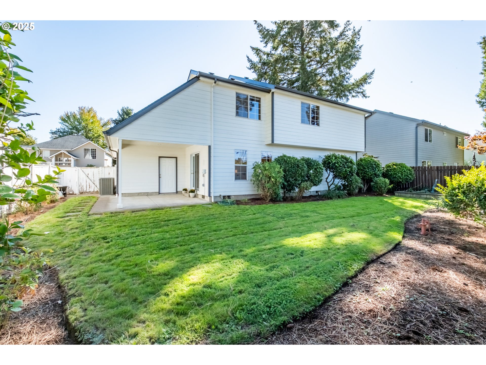 2009 Chase Loop Southwest Albany, OR 97321 - Photo 47 of 48 a view of a house with yard and a garden