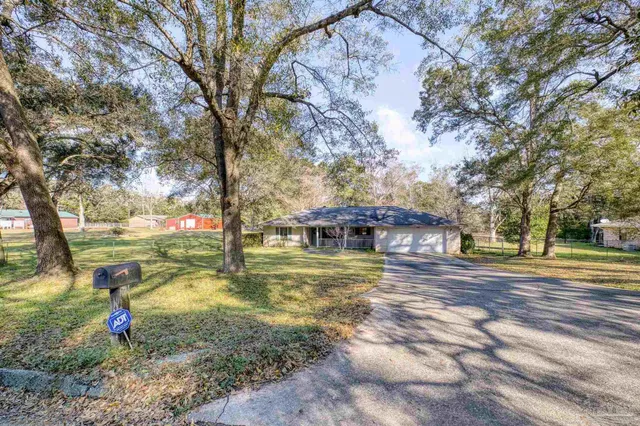 a bedroom with a bed and a bookshelf