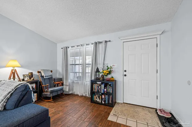 a bathroom with a sink a light fixture and a mirror