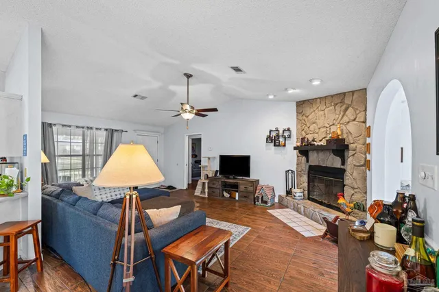 a kitchen with stainless steel appliances granite countertop a sink a stove and cabinets