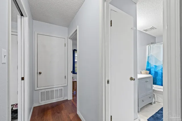 a view of a house with a yard chairs and a yard